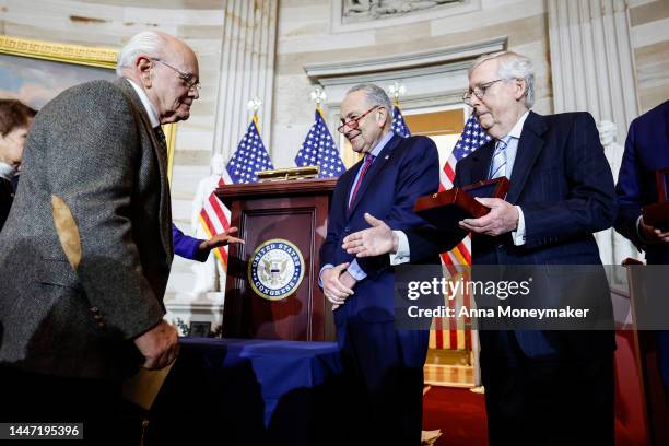 Senate Minority Leader Mitch McConnell holds out his hand for a handshake with Charles Sicknick , the father of Capitol Police officer Brian Sicknick...