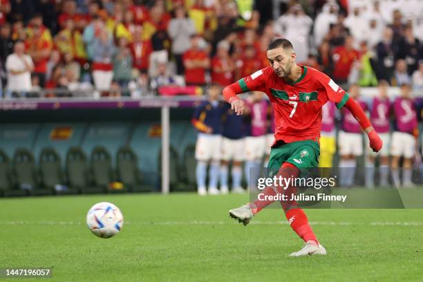 Hakim Ziyech of Morocco scores the team's second penalty in the penalty shoot out during the FIFA World Cup Qatar 2022 Round of 16 match between...