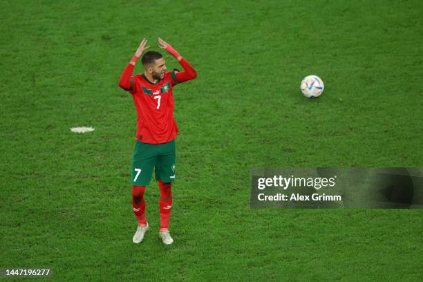 Hakim Ziyech of Morocco celebrates scoring the team's second penalty in the penalty shoot out during the FIFA World Cup Qatar 2022 Round of 16 match...