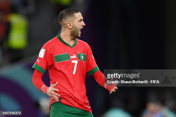 Hakim Ziyech of Morocco celebrates scoring the team's second penalty in the penalty shoot out during the FIFA World Cup Qatar 2022 Round of 16 match...