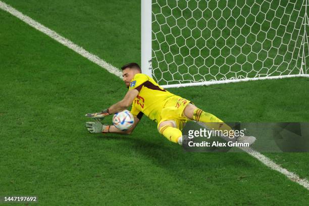 Unai Simon of Spain saves the third penalty by Badr Benoun of Morocco in the penalty shoot out during the FIFA World Cup Qatar 2022 Round of 16 match...