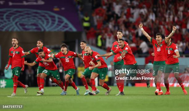 Morocco players celebrate their victory through the penalty shootout after the FIFA World Cup Qatar 2022 Round of 16 match between Morocco and Spain...