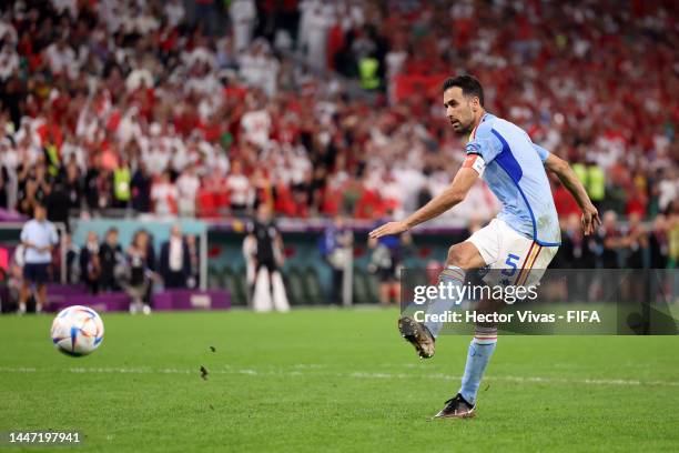 Sergio Busquets of Spain shoots the team's third penalty saved by Yassine Bounou of Morocco in the penalty shoot out during the FIFA World Cup Qatar...