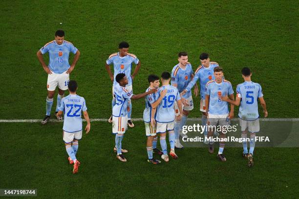 Carlos Soler of Spain reacts with teammates after missing their side's second penalty in the penalty shoot out during the FIFA World Cup Qatar 2022...