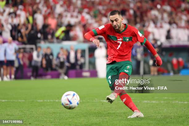 Hakim Ziyech of Morocco scores the team's second penalty in the penalty shoot out during the FIFA World Cup Qatar 2022 Round of 16 match between...