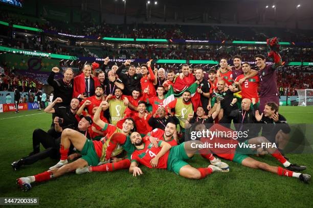 Morocco players celebrate after their win in the penalty shoot out during the FIFA World Cup Qatar 2022 Round of 16 match between Morocco and Spain...