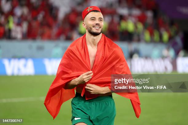 Romain Saiss of Morocco celebrates the team's victory through the penalty shootout in the FIFA World Cup Qatar 2022 Round of 16 match between Morocco...