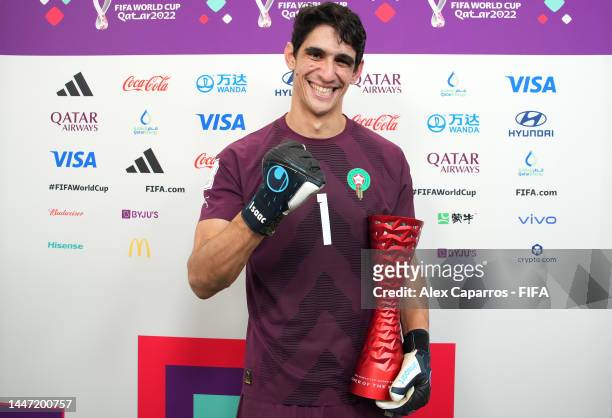 Yassine Bounou of Morocco poses with the Budweiser Player of The Match trophy during the FIFA World Cup Qatar 2022 Round of 16 match between Morocco...