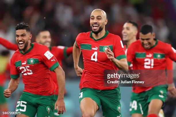 Yahya Attiat-Allah and Sofyan Amrabat of Morocco celebrate after their win in the penalty shoot out during the FIFA World Cup Qatar 2022 Round of 16...