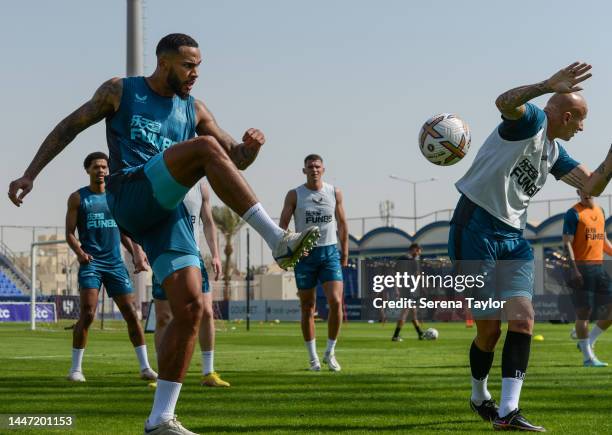 Jamaal Lascelles volley's the ball during the Newcastle United Training Session at the Al Hilal FC Training Centre on December 06, 2022 in Riyadh,...