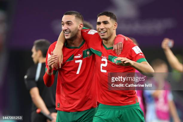 Hakim Ziyech and Achraf Hakimi of Morocco celebrate after the team's victory during the FIFA World Cup Qatar 2022 Round of 16 match between Morocco...