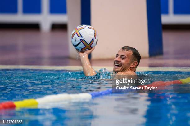 Ryan Fraser thows the ball in the pool during the Newcastle United Training Session at the Al Hilal FC Training Centre on December 06, 2022 in...