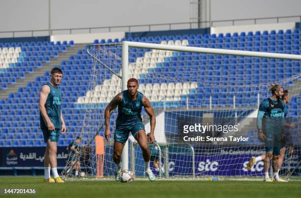 Joelinton looks to pass the ball during the Newcastle United Training Session at the Al Hilal FC Training Centre on December 06, 2022 in Riyadh,...