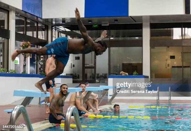 Allan Saint-Maximin dives off the block during the Newcastle United Training Session at the Al Hilal FC Training Centre on December 06, 2022 in...