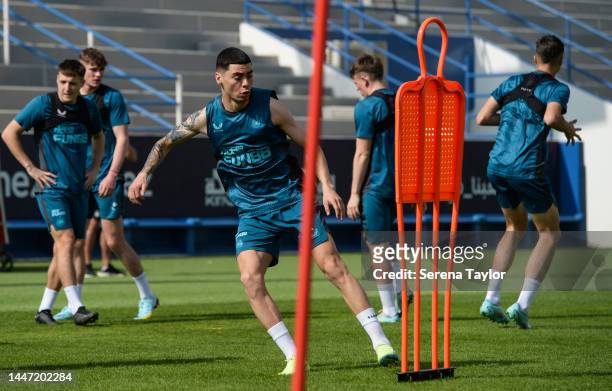 Miguel Almirón runs to the training mannequin during the Newcastle United Training Session at the Al Hilal FC Training Centre on December 06, 2022 in...