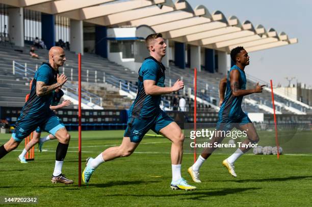 Jonjo Shelvey Matt Targett and Joe Willock run during the Newcastle United Training Session at the Al Hilal FC Training Centre on December 06, 2022...