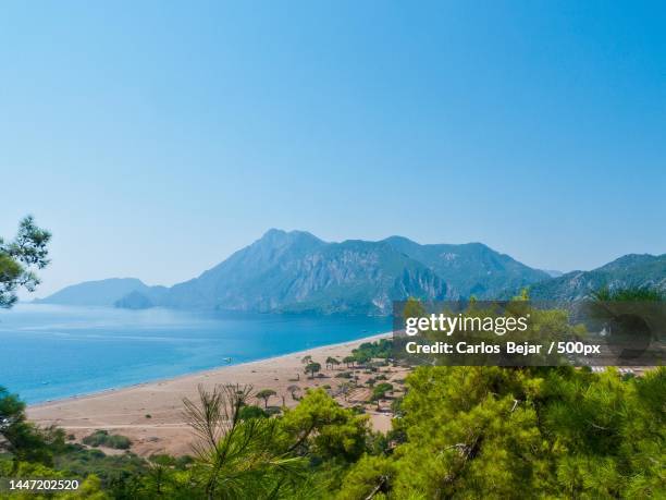 scenic view of sea and mountains against clear blue sky - turquía 個照片及圖片檔