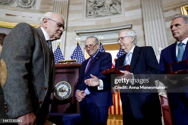 Senate Minority Leader Mitch McConnell holds out his hand for a handshake with Charles Sicknick , the father of Capitol Police officer Brian Sicknick...