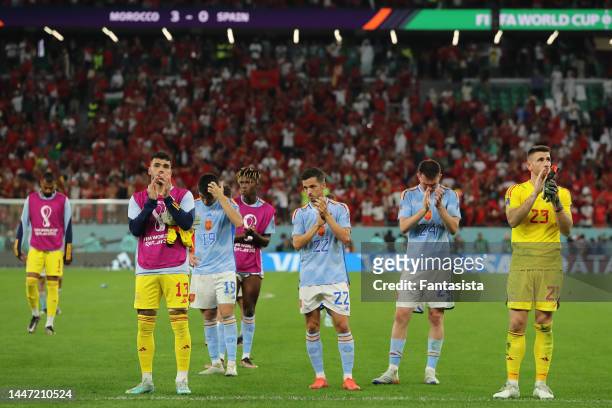 David Raya, Carlos Soler, Nico Williams, Pablo Sarabia, Aymeric Laporte and Unai Simon of Spain react in front the fans following the penalty shoot...