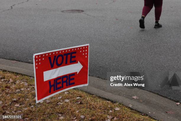 Vote Here" sign is seen outside a polling station on December 6, 2022 in Atlanta, Georgia. Georgians head to the polls today to cast their ballots in...