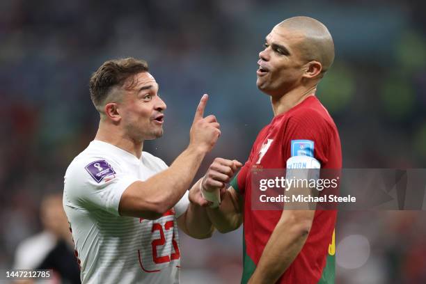 Xherdan Shaqiri of Switzerland and Pepe of Portugal argue during the FIFA World Cup Qatar 2022 Round of 16 match between Portugal and Switzerland at...