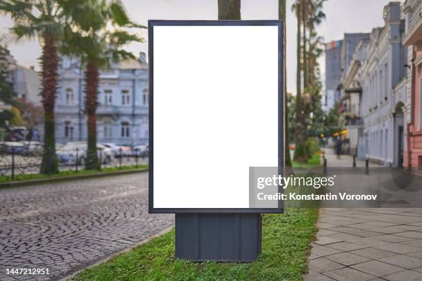 blank city format (lightposter, citylight) banner pylon on the sidewalk mockup. - digital display ad stock pictures, royalty-free photos & images