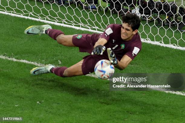 Yassine Bounou of Morocco makes a save against a penalty by Carlos Soler of Spain in the penalty shoot out during the FIFA World Cup Qatar 2022 Round...