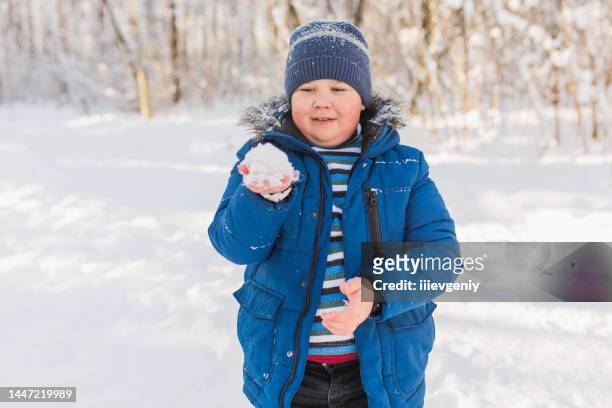 children play and have fun in winter forest. running and moving. happy childhood. winter holiday. deep snow. boys and girls. warm clothes - childhood obesity stock pictures, royalty-free photos & images