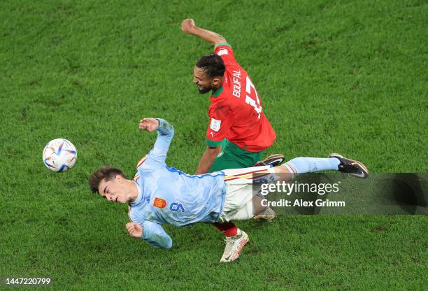 Gavi of Spain battles for possession with Sofiane Boufal of Morocco during the FIFA World Cup Qatar 2022 Round of 16 match between Morocco and Spain...