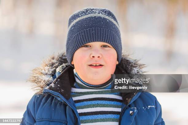 children play and have fun in winter forest. running and moving. happy childhood. winter holiday. deep snow. boys and girls. warm clothes - childhood obesity stock pictures, royalty-free photos & images