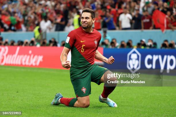 Raphael Guerreiro of Portugal celebrates after scoring the team's fourth goal during the FIFA World Cup Qatar 2022 Round of 16 match between Portugal...