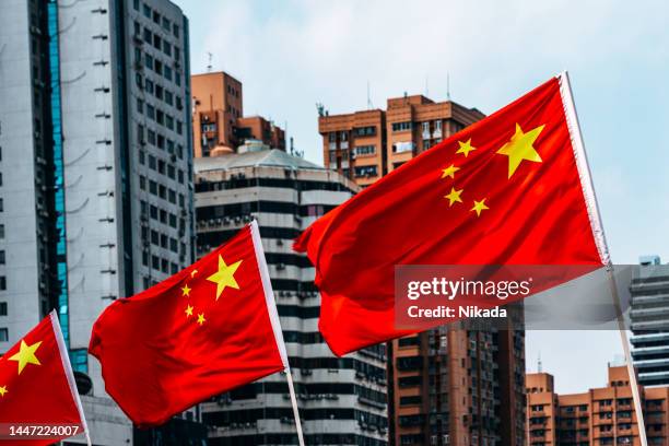 chinese flag waving in china - beijing sign stock pictures, royalty-free photos & images