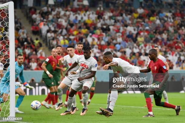 Manuel Akanji of Switzerland scores the team's first goal during the FIFA World Cup Qatar 2022 Round of 16 match between Portugal and Switzerland at...