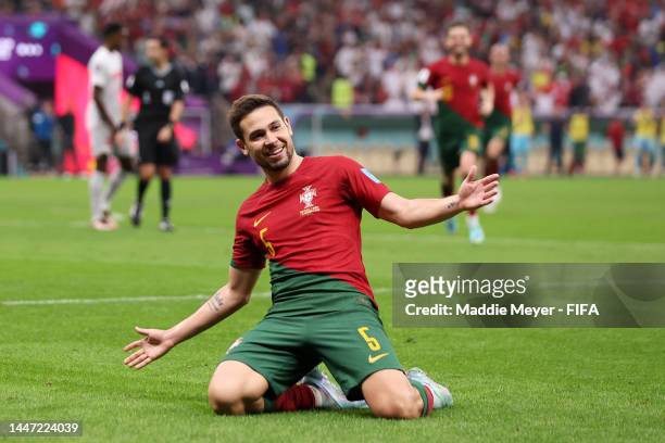Raphael Guerreiro of Portugal celebrates after scoring the team's fourth goal during the FIFA World Cup Qatar 2022 Round of 16 match between Portugal...