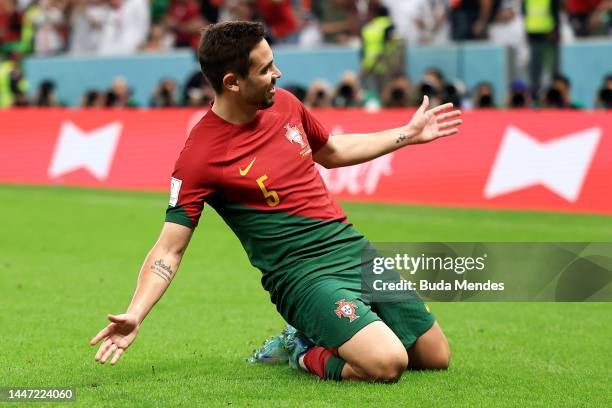 Raphael Guerreiro of Portugal celebrates after scoring the team's fourth goal during the FIFA World Cup Qatar 2022 Round of 16 match between Portugal...