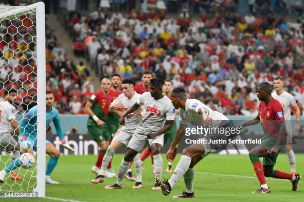 Manuel Akanji of Switzerland scores the team's first goal during the FIFA World Cup Qatar 2022 Round of 16 match between Portugal and Switzerland at...