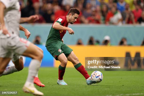 Raphael Guerreiro of Portugal scores the team's fourth goal during the FIFA World Cup Qatar 2022 Round of 16 match between Portugal and Switzerland...