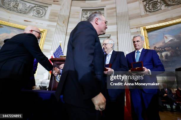 Kenneth and Craig Sicknick, the brothers of Capitol Police officer Brian Sicknick who died after the events of January 6, walk past Senate Minority...