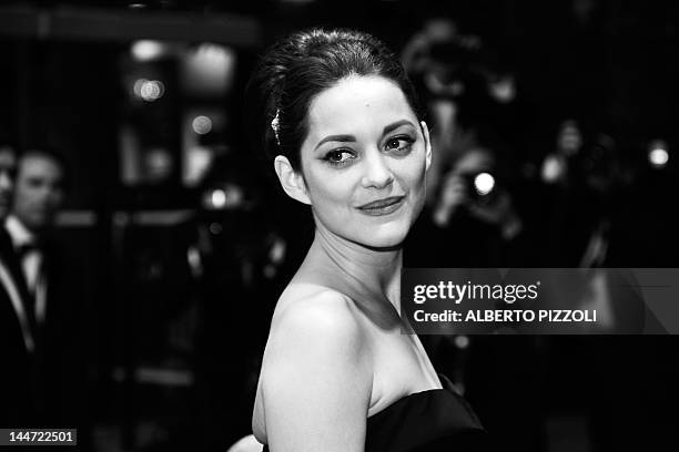 French actress Marion Cotillard leaves after the screening of "De Rouille et D'Os" presented in competition at the 65th Cannes film festival on May...