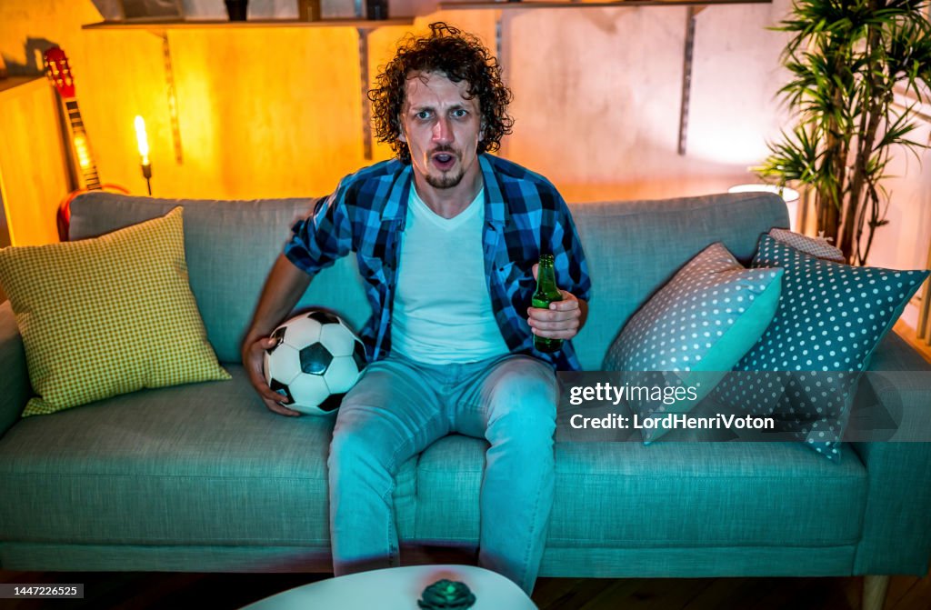 Man Watching A Soccer Match At Home High Res Stock Photo Getty Images support-for-an-all-ireland-soccer-team-is-growing-goal