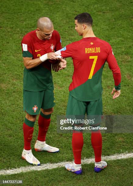 Cristiano Ronaldo of Portugal wears the captain's armband worn by Pepe after being brought in during the FIFA World Cup Qatar 2022 Round of 16 match...