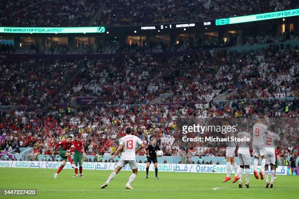 Cristiano Ronaldo of Portugal takes a free kick during the FIFA World Cup Qatar 2022 Round of 16 match between Portugal and Switzerland at Lusail...