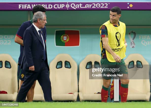 Cristiano Ronaldo of Portugal is seen before being brought in by Fernando Santos, Head Coach of Portugal, during the FIFA World Cup Qatar 2022 Round...