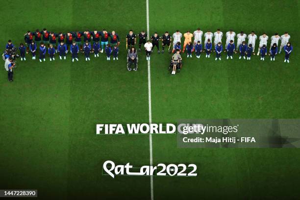Players and match officials line up prior to the FIFA World Cup Qatar 2022 Round of 16 match between Portugal and Switzerland at Lusail Stadium on...