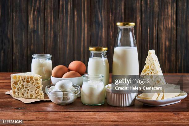 dairy products on rustic wooden table with copy space. - produit laitier photos et images de collection