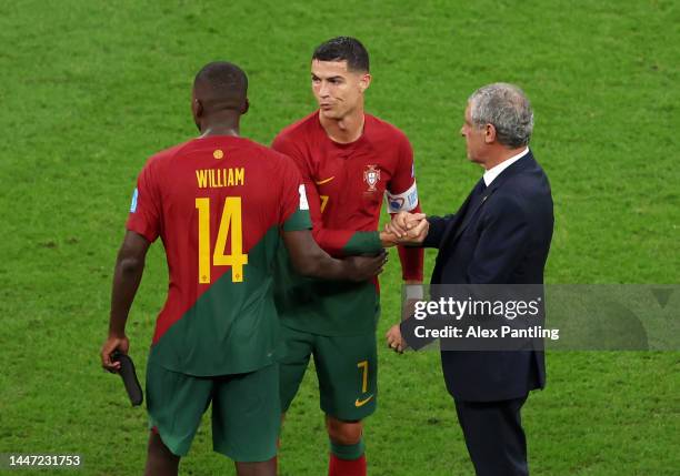 Fernando Santos, Head Coach of Portugal, interacts with William Carvalho and Cristiano Ronaldo after the 6-1 win during the FIFA World Cup Qatar 2022...