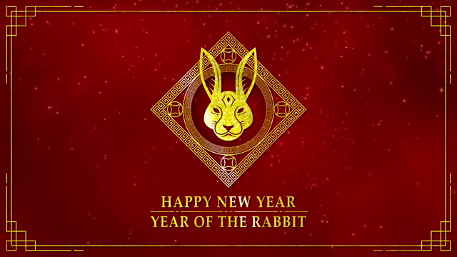 Motion graphic of Golden rabbit logo with chinese new year and year of the Rabbit 2023 on dark red background and glitter particle in a happy new year concept seamless loop video