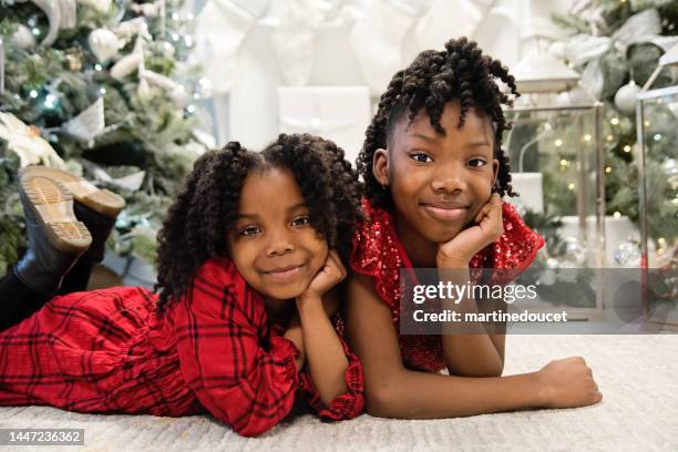 cute little girls portrait in christmas setting. - december 6 stock pictures, royalty-free photos & images