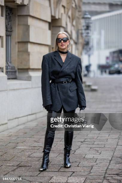 Tina Haase wears grey vintage oversize wool blazer, black Vinyl pants, Jeffrey Campbell metal toe boots, publishedby chrome hand bag, Saint Laurent...