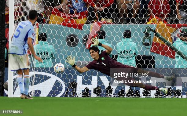 Sergio Busquets of Spain watches as his penalty is saved by Yassine Bounou of Morocco in the shoot out after extra time during the FIFA World Cup...